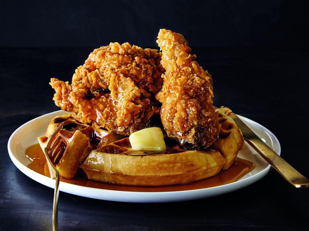 Fried Chicken and Waffles · Waffle served with 4 pieces of fried chicken and our homemade honey maple barbecue sauce.