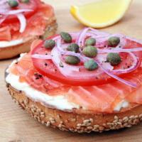 Bagel Deluxe · Bagel with lox, cream cheese, olives, red onions, lettuce and tomatoes.