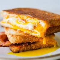 Breakfast Double Fried Egg Sandwich · Breakfast double fried egg sandwich. Served on white toast. Served with your choice of break...