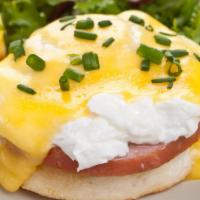 Classic Eggs Benedict · Two Poached Eggs, Canadian Bacon & Hollandaise. Served Over Toasted English Muffin With Home...