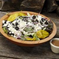Greek Salad · Heritage mix, red onions, feta, Kalamata olives and pepperoncini.