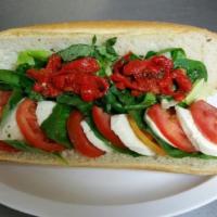 Mozzarella Caprese Sandwich · Fresh mozzarella, basil, Roma tomatoes, roasted peppers, lettuce, balsamic vinaigrette. Serv...