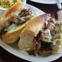 Cheesesteak Pastrami Sandwich · Grilled roast beef and pastrami, mayo, mustard, pickles, grilled peppers, onions, and mushro...