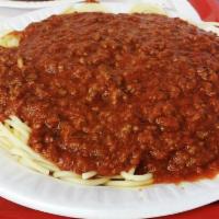 Spaghetti with Meat Sauce · Served with garlic bread.