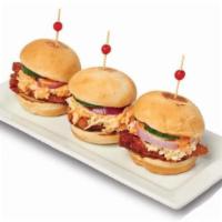 Crispy Chicken Sliders (3) · Garlic crispy chicken strips with fresh cucumber, red onions and coleslaw and served on a mi...