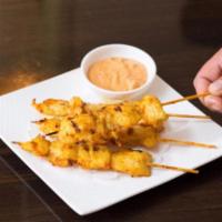A8. Satay · The most popular appetizer in Thai cuisine. Grilled chicken or beef on skewers with peanut s...