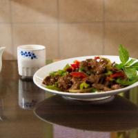 TB7. Volcano Beef · Sliced beef stir fried with cayenne pepper, jalapeno, onion and basil. Hot and spicy. 