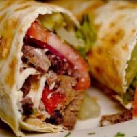 Roasted Lamb Roll · Roasted lamb, tomatoes, red onions, feta, roasted red peppers and yogurt dressing rolled wit...