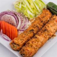 Chicken Adana Kebab · Served with rice, lettuce, onions and tomatoes. 