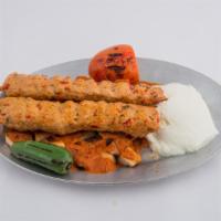 Yogurt Kebabs · Served with bread cubes, tomato sauce and grilled peppers.