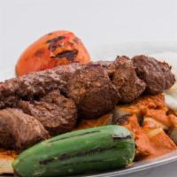 Yogurt Beef Shish Kebab · Served with bread cubes, tomato sauce and grilled peppers