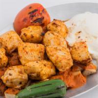Yogurt Chicken Shish Kebab · Served with bread cubes, tomato sauce and grilled peppers