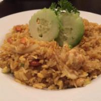 Pineapple Fried Rice · Rice with pineapple chunks, cashew nuts, onions and egg. With yellow curry powder.