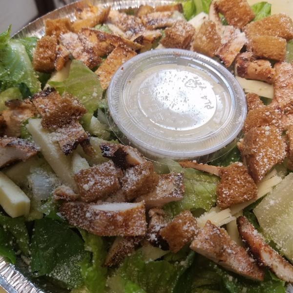 Grilled Chicken Caesar Salad · Grilled chicken, romaine lettuce and croutons. Topped with Pecorino Romano and provolone cheese.