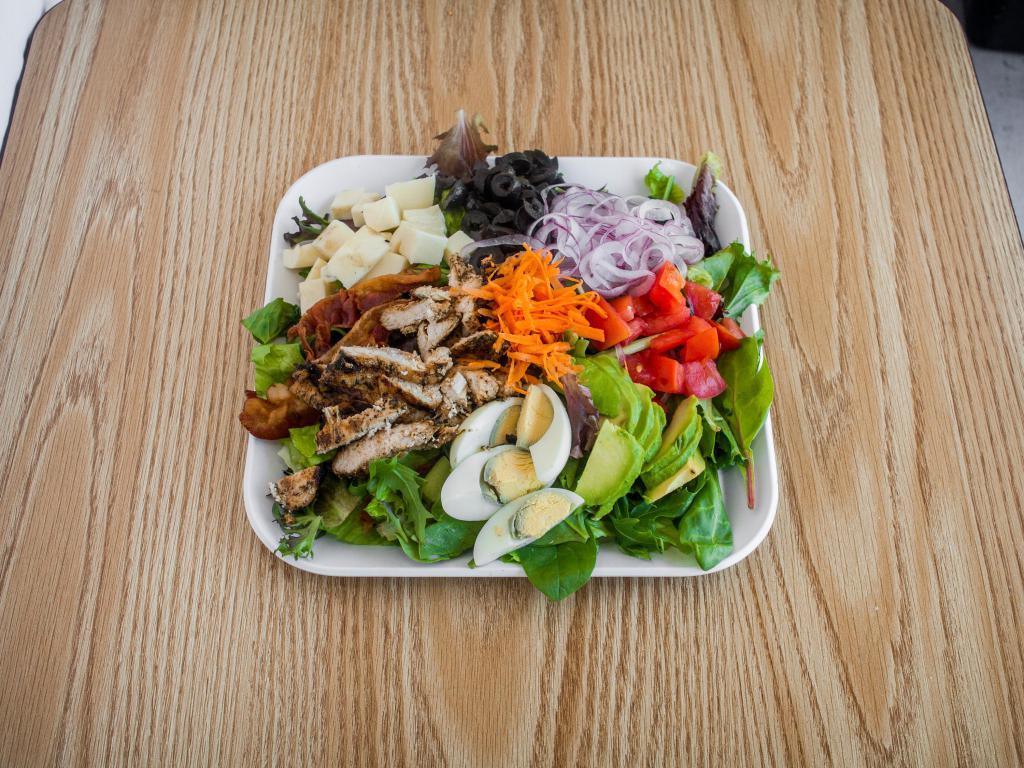 Grilled Chicken Cobb Salad · Grilled chicken, romaine lettuce, chopped bacon, diced tomato, red onion, avocado, sliced pepper jack and chopped black olives.