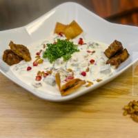 Eggplant Peasant Bowl · Bread crumbs topped with crisped eggplant, garlic-yogurt, parsley, fried almonds, and dried ...