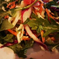 Rangoli Salad · Bright and refreshing seasonal greens, cabbage, carrots, tomatoes, tossed in a home made gin...