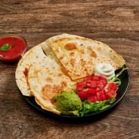 Quesadilla Mexicana · Flour tortilla stuffed with melted cheese, served with guacamole and sour cream.