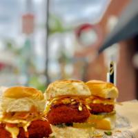 Fried Chicken Sliders · 3 Fried chicken sliders topped with coleslaw, pickles & chipotle on a Hawaiian Bun