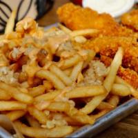 Chicken tenders · marinated fried chicken tender with a side of garlic fries and gravy