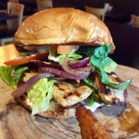 Grilled Chicken Sandwich · Marinated grilled chicken breast topped with lettuce, tomatoes, grilled onions, pickles chip...