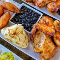 Cuban Style Plate · 1/2 Roasted chicken on a bed of White rice, side of black beans, and plantains. Served with ...