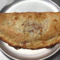 The Sammy Special Calzone · Loaded with Pepperoni, Cheese, Ham, Sausage, Bacon, Onions, Black Olives, and Mushrooms