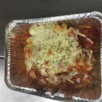 Lasagna · Served with meat sauce.
