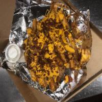 Sammy T's Loaded Bacon Fries · Our seasoned fries loaded with cheese and bacon. Very generous size.