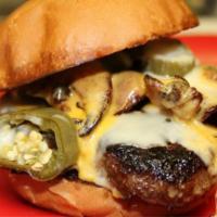 Adam Bomb Burger · Jalapeno, bacon, mushroom, onion ring, and Cheddar cheese. Big 1/2 lb burger with 1 side, pi...