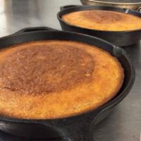 Corn Bread (2pc) · Baked in our cast iron skillets. Just like everything else here and it’s made from scratch.
