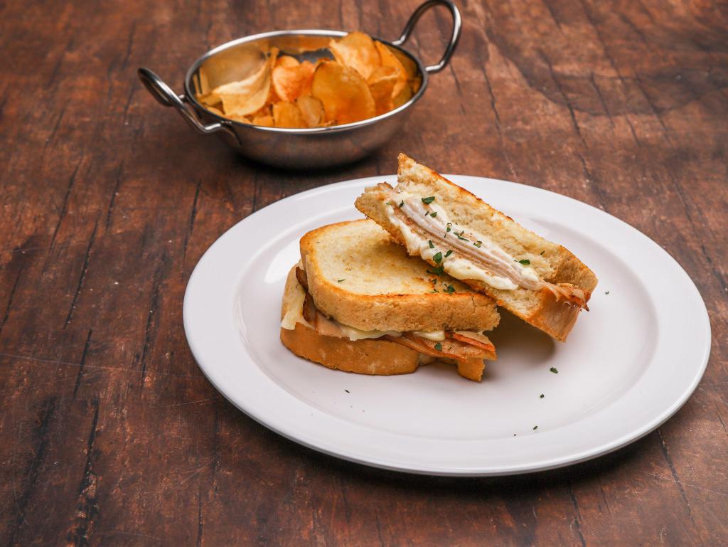 Turkey Melt Sandwich · Sourdough rye and Swiss cheese. Served with homemade chips.