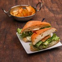 Chicken Salad Sandwich · Tomatoes and lettuce on ciabatta bread. Served with homemade chips.