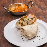 Chicken Caesar Wrap · Grilled chicken, lettuce and Caesar dressing. Served with homemade chips.