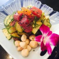 Hawaiian Poki Salad · Tuna, seaweed, sesame seeds, onion, cucumber, macadamia nuts, masago and scallions. Spicy.