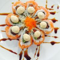 Orange Blossom Roll · Spicy tuna avocado topped with salmon, tobiko and spicy mayo