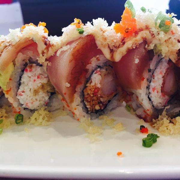 Joe's Roll · Crab meat and shrimp tempura topped with albacore, avocado and tobiko
