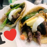 tacos poblanos · Two tacos filled with rice, rajas, egg and your preferer meat!