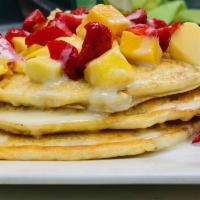 fruit pancakes! · three pieces of pancakes topped with Fruit (mango & strawberry) and glazed with sweetened co...