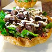 Taco Bowl · crispy tortilla taco bowl filled with beans, rice, salad, your meat choice and topped with s...