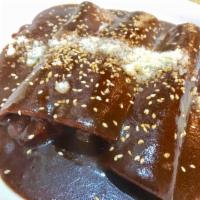 Enchiladas de Mole · three roll soft tacos filled with your meat choice or cheese and covered with mole souce and...