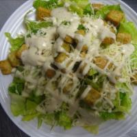 Caesar Salad · Tender hearts of romaine tossed with our special Caesar dressing. Served with Romano, Parmes...