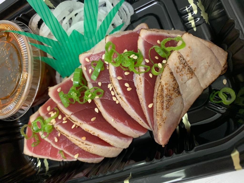 Tuna Tataki Appetizer · Thinly-sliced seared tuna with spicy ponzu sauce.