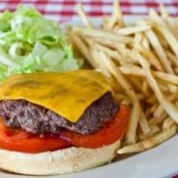 Simple American Burger · Melted American cheese, steak-cut tomato and lettuce. Served on brioche rolls with fries.
