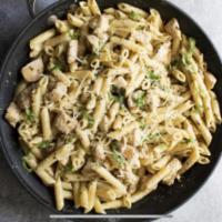Pesto Chicken Penne (Nut free Pesto) · Grilled chicken breast and penne pasta tossed in pesto sauce topped with Parmesan cheese.