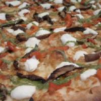 Roasted Portobello and Goat Cheese Pizza · A white pie with roasted portobello, caramelized onion, roasted red pepper, roasted garlic a...