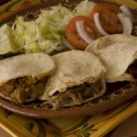 7. 3 Pieces Gorditas Plate · 3 gorditas de maiz servidas with cualquier guisado al gusto acompañadas with ensalada and un...