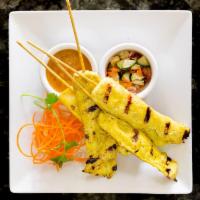 4 Chicken Satay · Skewers of grilled chicken marinated in a mixture of spices and coconut milk, served with pe...