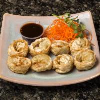 Veggie Gyoza · 8 pieces. Pan fried vegetarian pot stickers, served with house special soy dipping sauce.