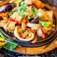 Seafood Pad Cha · Scallops, shrimp, mussels, calamari, fish and vegetables stir-fried with aromatic blend of T...